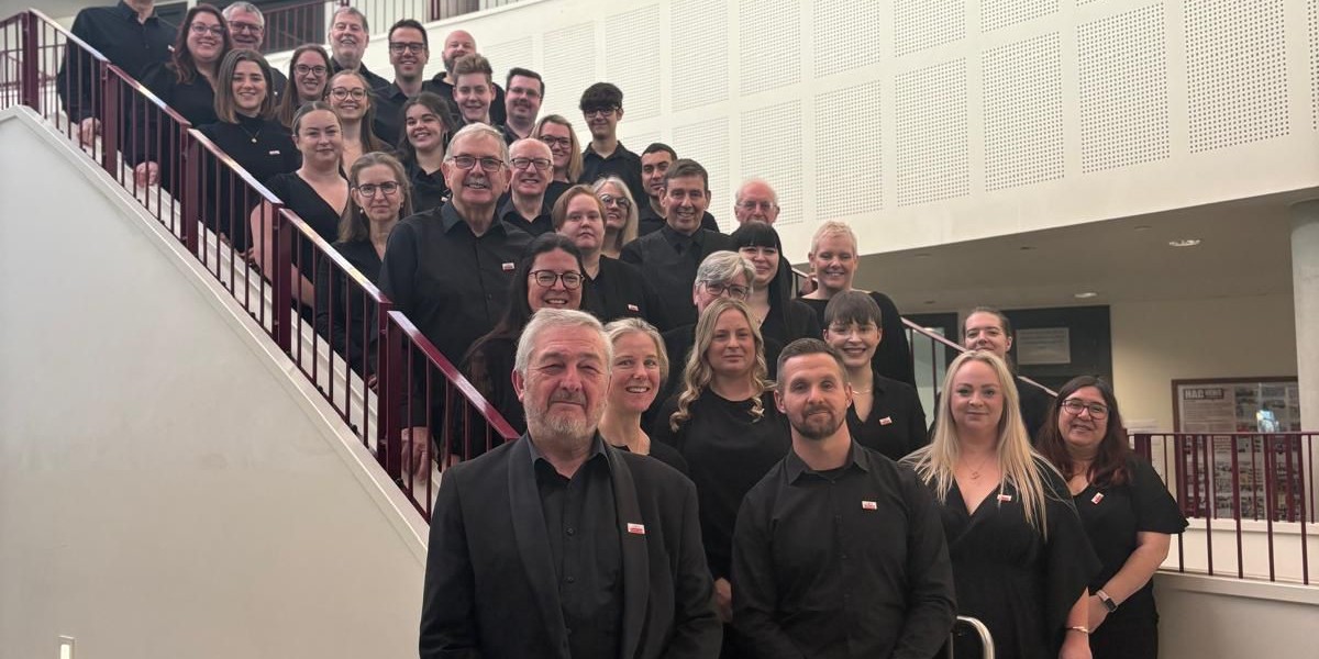 Telford Concert Band members in front of a pavilion